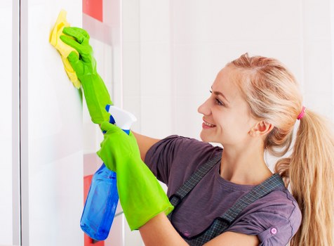 Carpet cleaning technician preparing equipment for a booked service